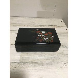 Black musical jewelry box with flowers on top